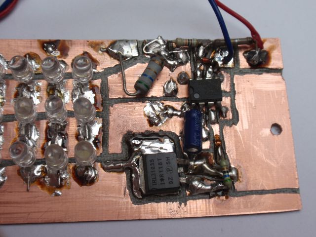 Oscillator circuit with 555, part of the LED panel and mosfet switch.